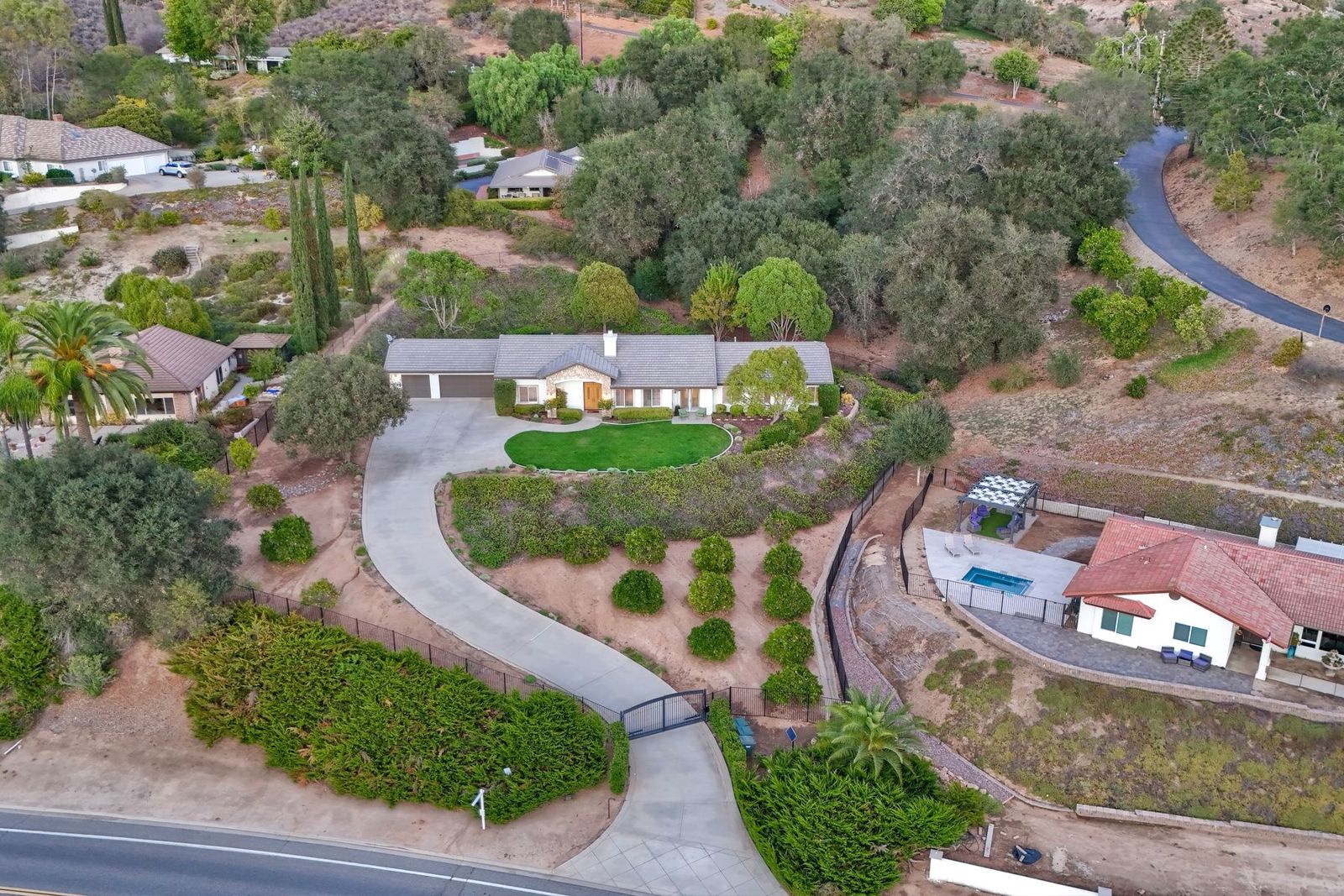 Aerial view of the gated drive and front lawn