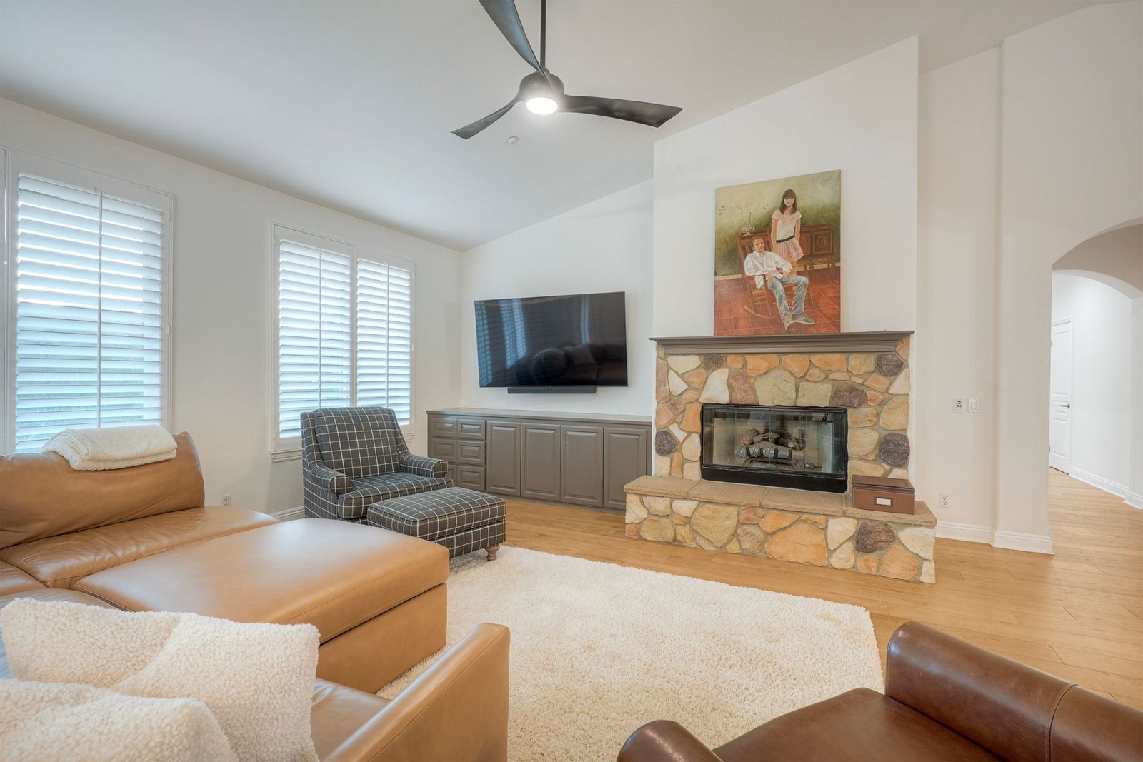 Living room with stone gas fireplace